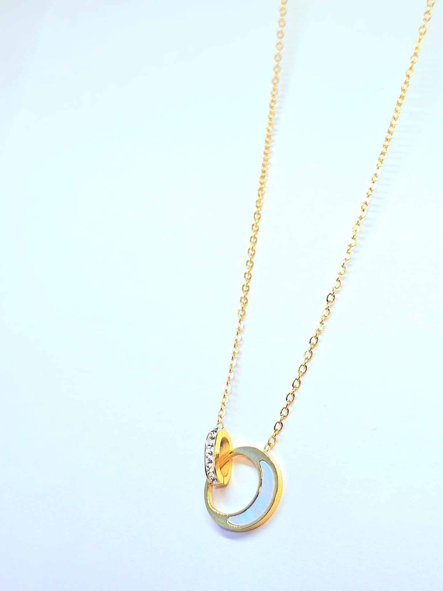 Elegant Gold Pendant Necklace with Interlocking Moon and Crystal Ring