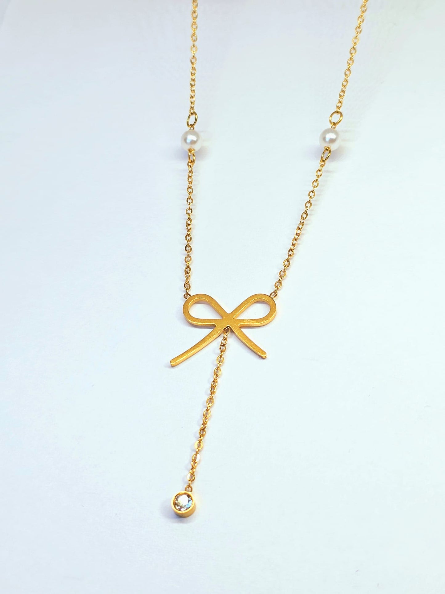 Gold Bow Pendant Necklace with Pearl Accents
