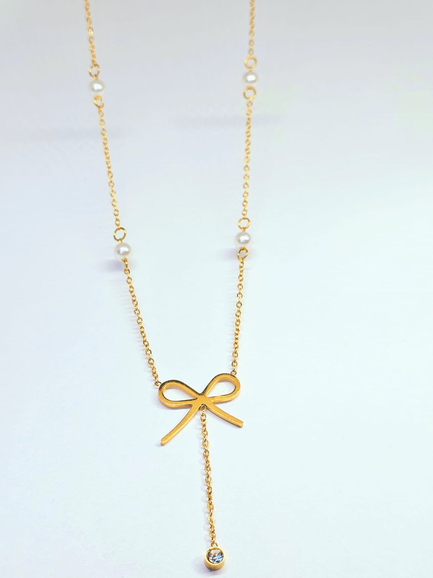 Gold Bow Pendant Necklace with Pearl Accents