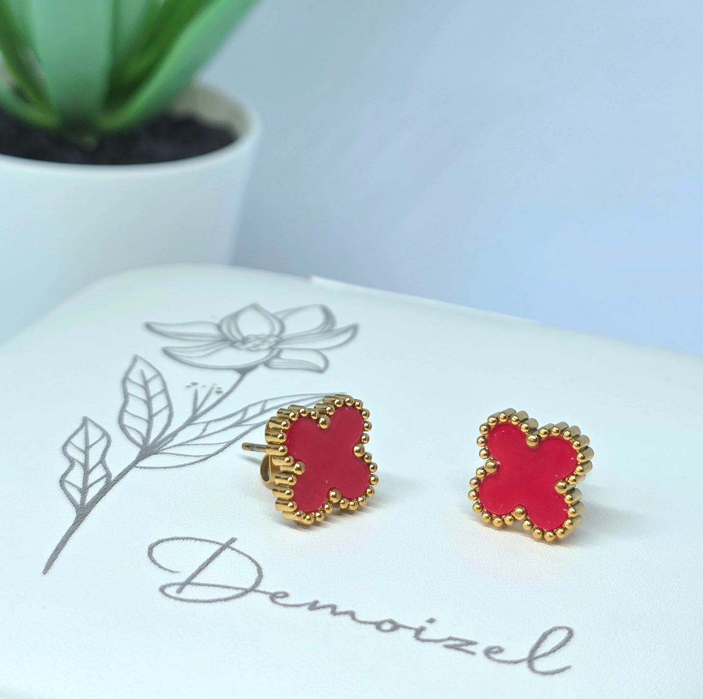 Gold Clover Earrings with Red Accent