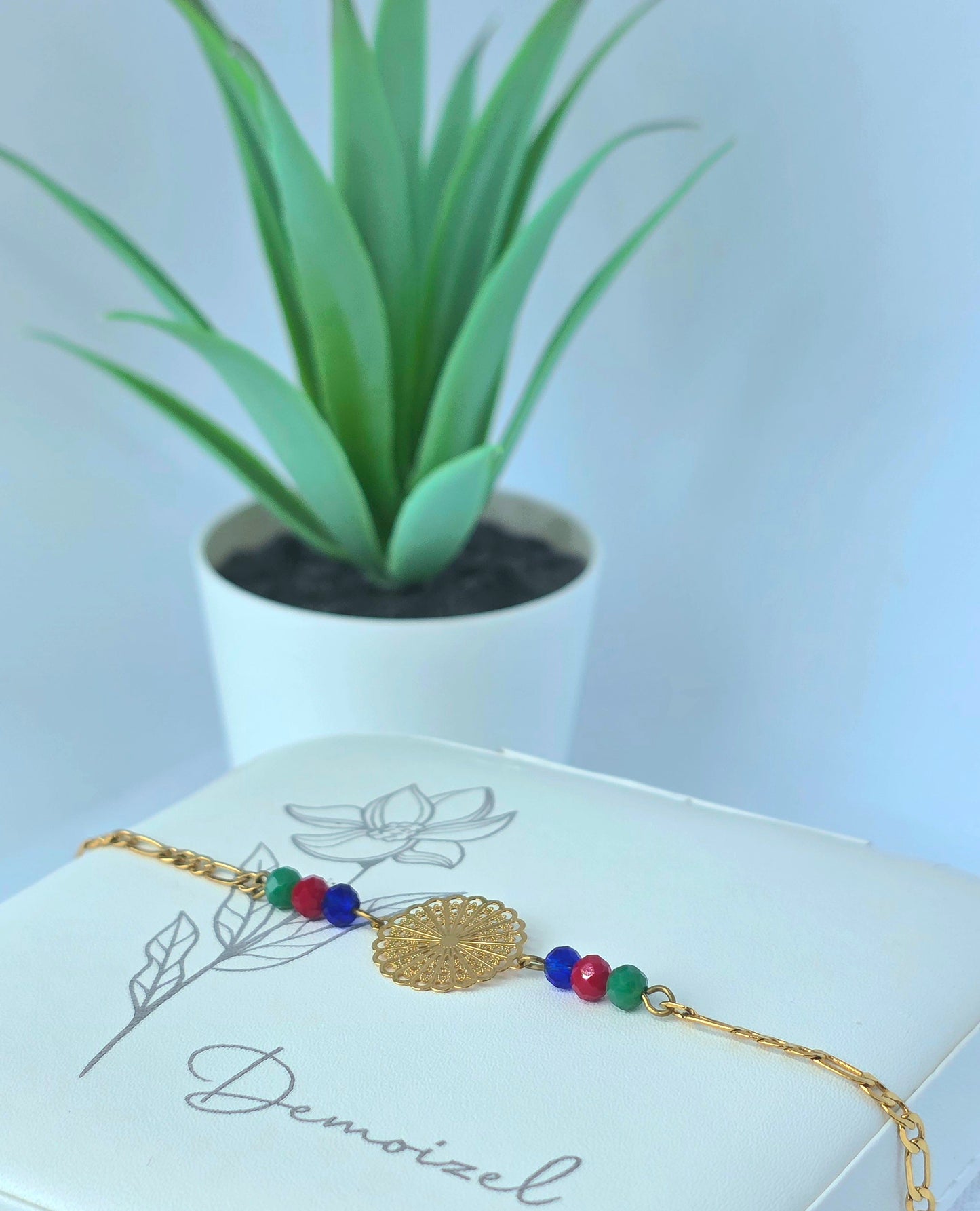 Gold Bracelet with Colorful Beads and Floral Medallion