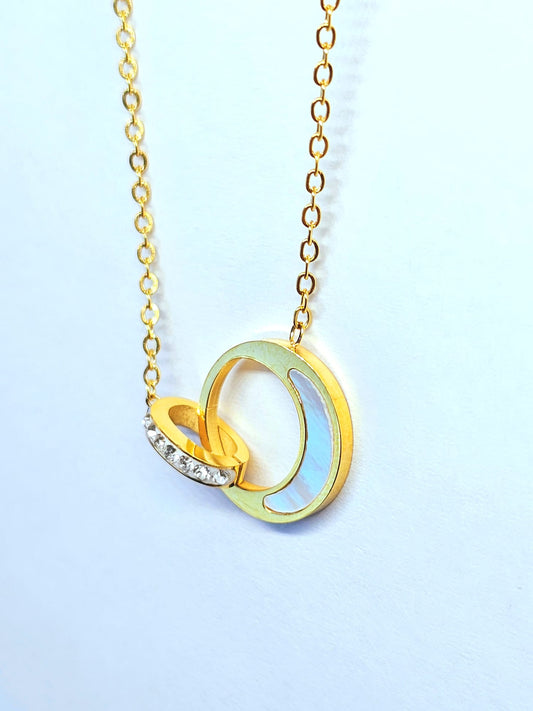 Elegant Gold Pendant Necklace with Interlocking Moon and Crystal Ring