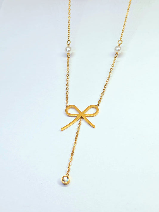 Gold Bow Pendant Necklace with Pearl Accents
